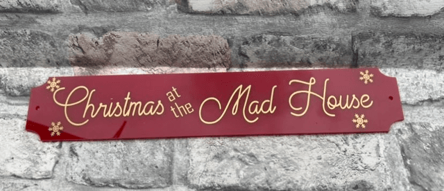 Christmas at the mad house sign